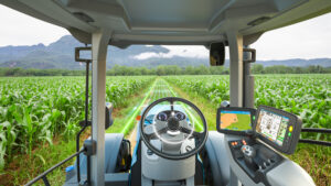 5G autonomous tractor working in corn field, Future technology w