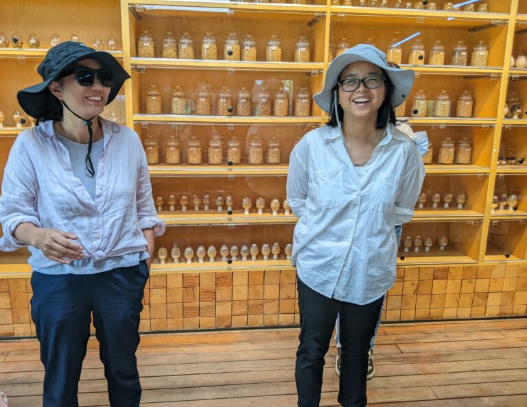 Ye SHEN and Xiumei ZHU in the farm's seed education center (left to right)