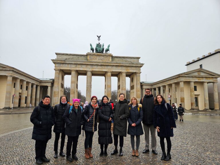 Participants of the steering committee meeting at the Brandenburg Gate, Berlin