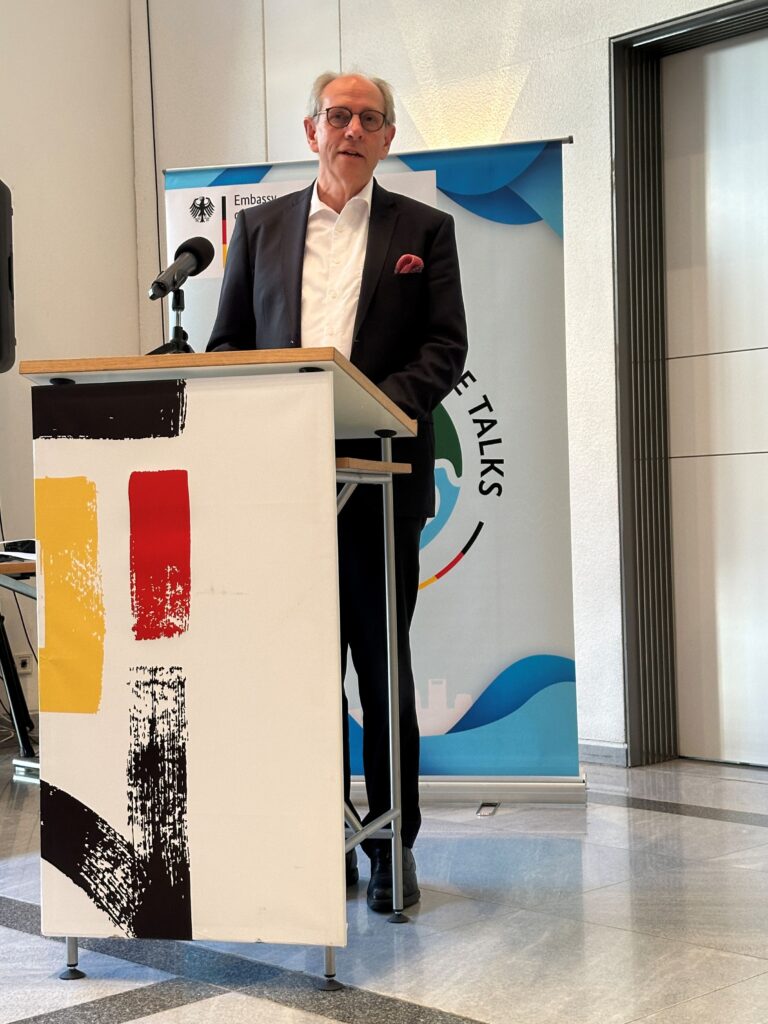 Stephan Grabherr, Chargé d'Affairs at the German Embassy welcomes the audience